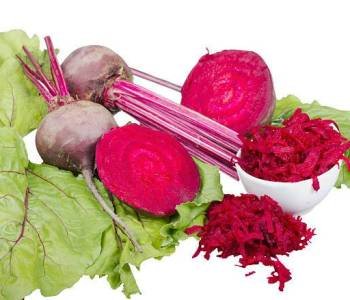Red beet's root and greens isolated on white background.