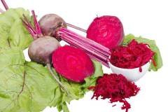 Red beet's root and greens isolated on white background.