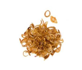 Crispy fried of shallots (Allium oschaninii, French gray shallot,  griselle or true shallot) or hom jiew in Thai, isolated on white background with clipping path top view flat lay.